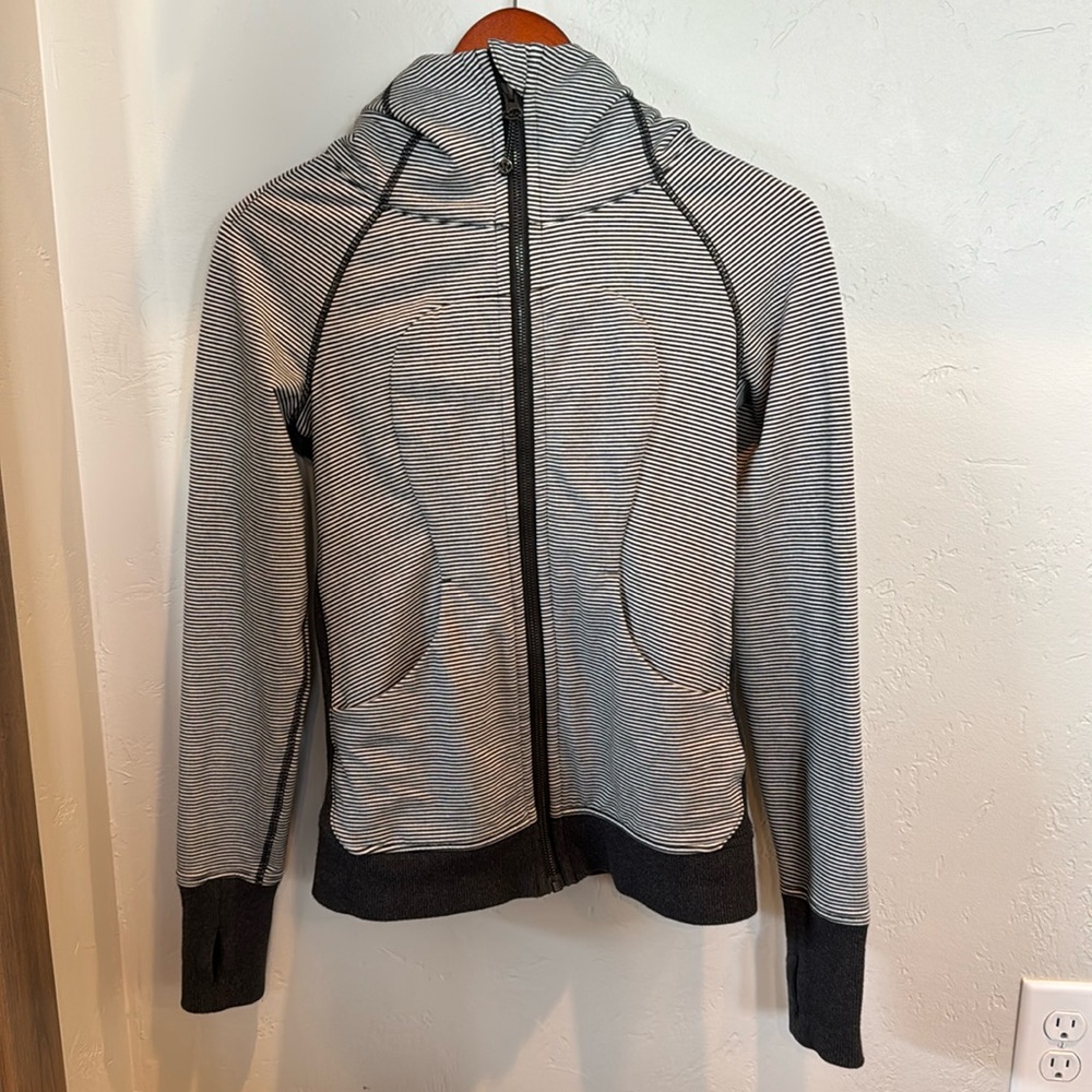 Women’s Lulu Lemon hooded sweatshirt. Size 4. White and gray stripes.